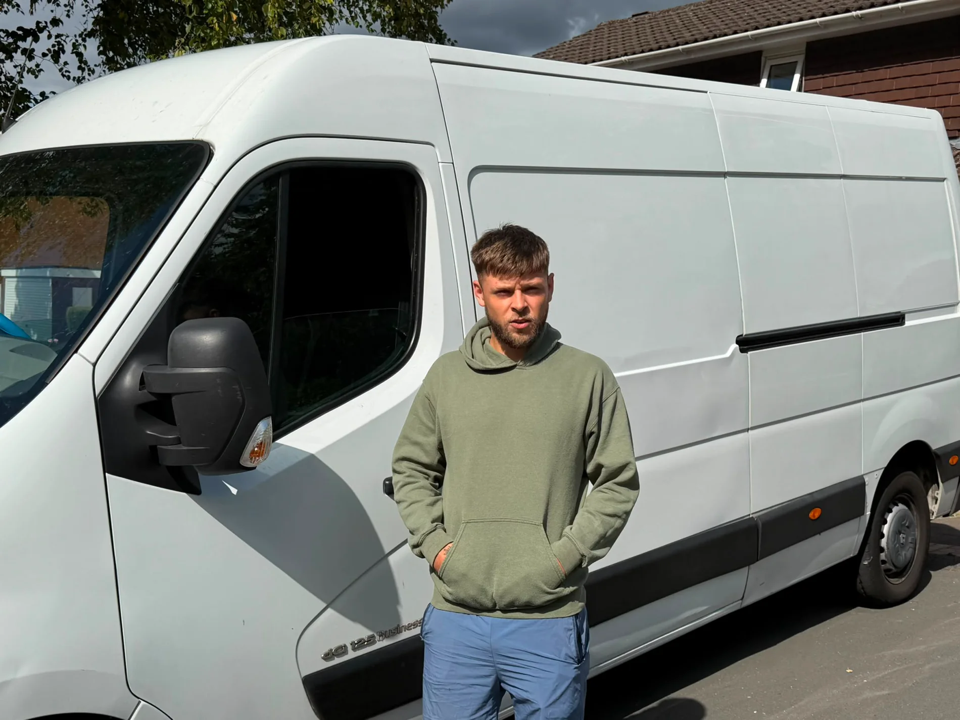 Josh from Hobberry Deliveries and Removals standing beside the van